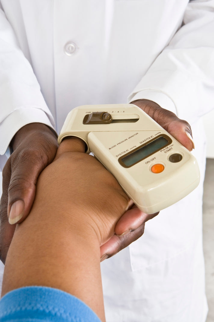 Doctor checks blood pressure for patient