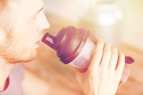 close up of man drinking protein shake to illustrate Bariatric Protein Shakes