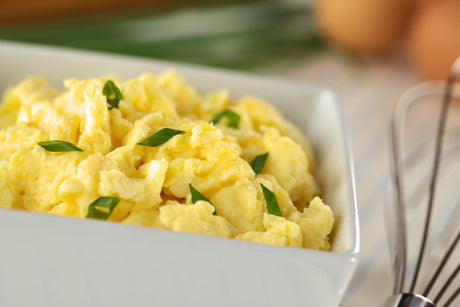 Scrambled eggs with green onion in bowl to illustrate Bariatric Soft Food Breakfast Ideas