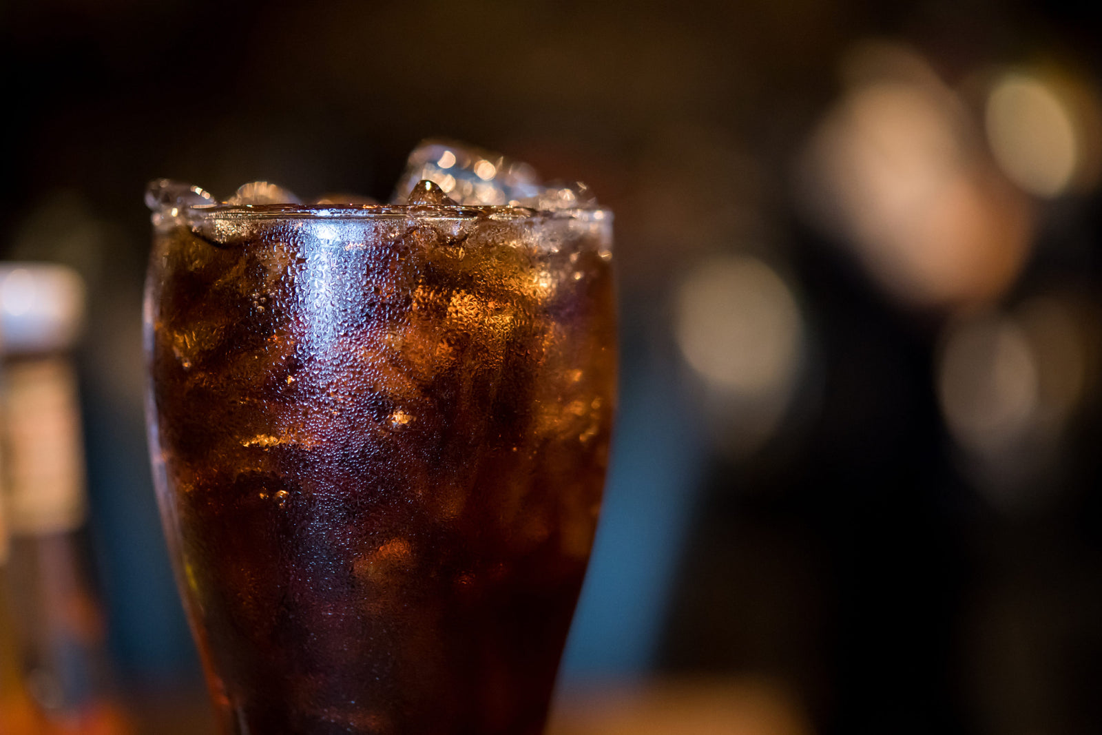 glass of cola with ice to illustrate How Long After Bariatric Surgery Can You Have Caffeine