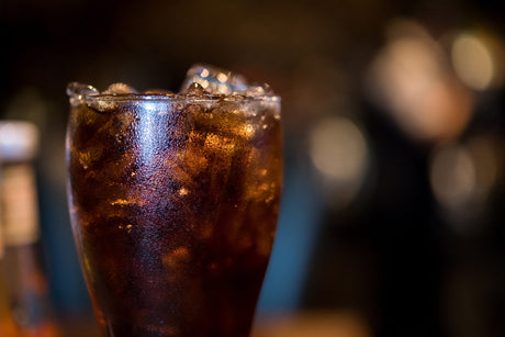glass of cola with ice to illustrate How Long After Bariatric Surgery Can You Have Caffeine