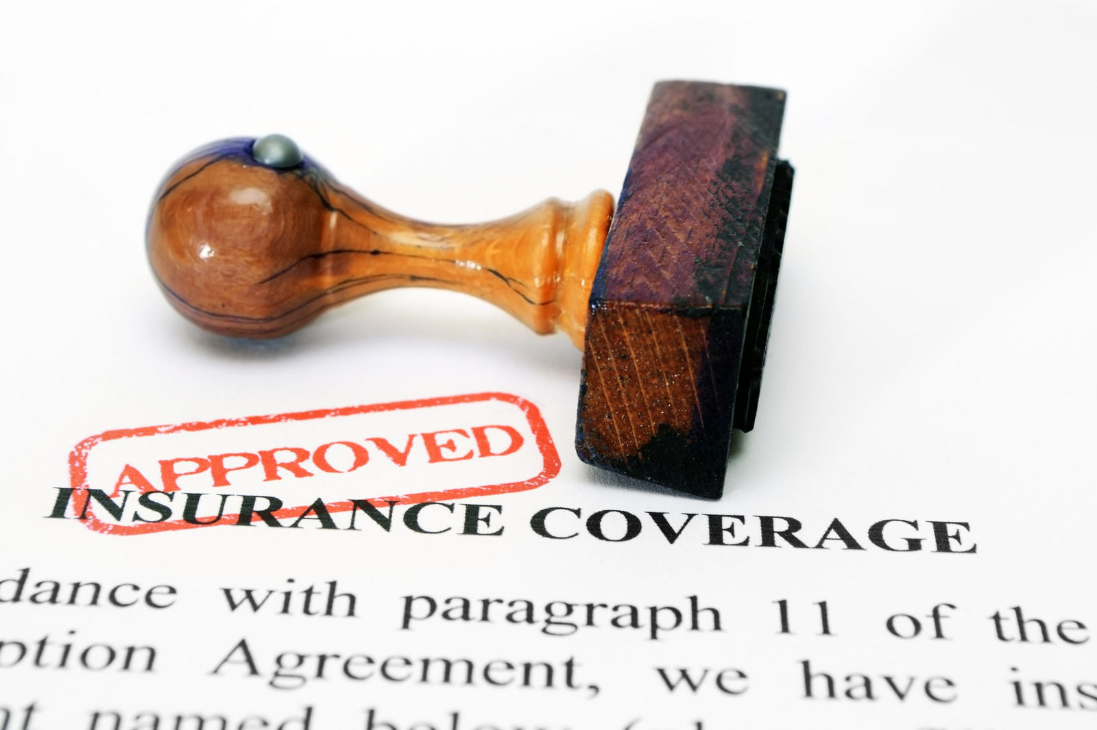 Insurance coverage and wooden approved stamp to illustrate How much does insurance pay for weight loss surgery