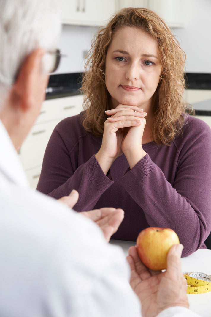 woman meets with doctor to talk about gastric bypass surgery