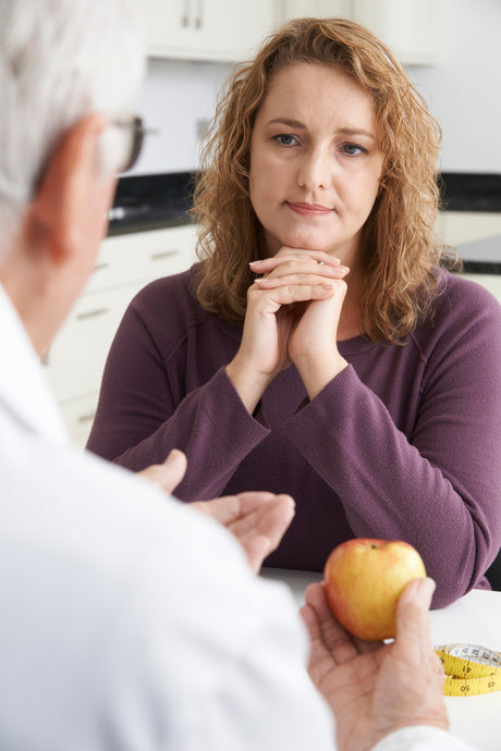 woman meets with doctor to talk about gastric bypass surgery