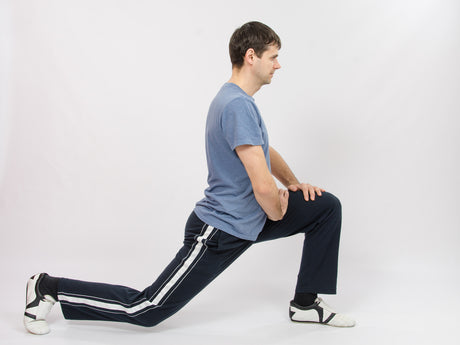 The athlete performs squats as suggested by his personal trainer