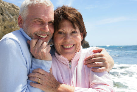 Mature couple hugging on the beach to illustrate intimacy after gastric sleeve and is bariatric surgery right for me and Improved Quality of Life After Weight Loss Surgery