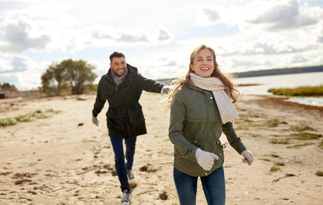 Fit couple running on the beach