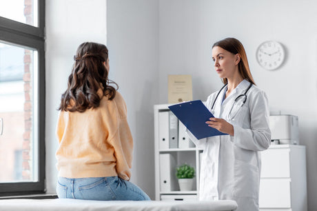 A doctor speaking with her patient in a hospital room discussing Bariatric Surgery vs. Non-Surgical Weight Loss Methods and What are Weight-Related Comorbidities