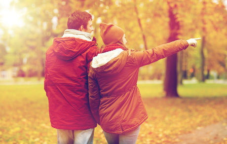 Couple walking on a path in fall