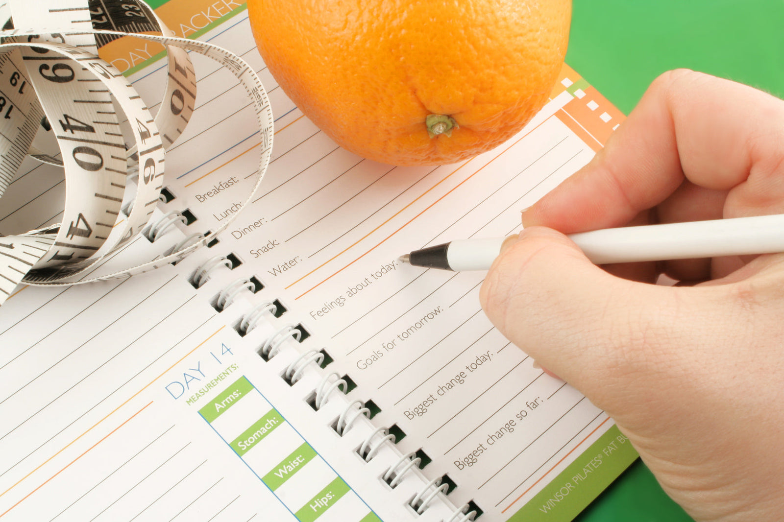 diet journal to illustrate Closeup of woman tying running shoes to illustrate Open Gastric Bypass — and What We Recommend