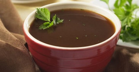 A bowl of protein soup in a red bowl to illustrate high protein bariatric foods