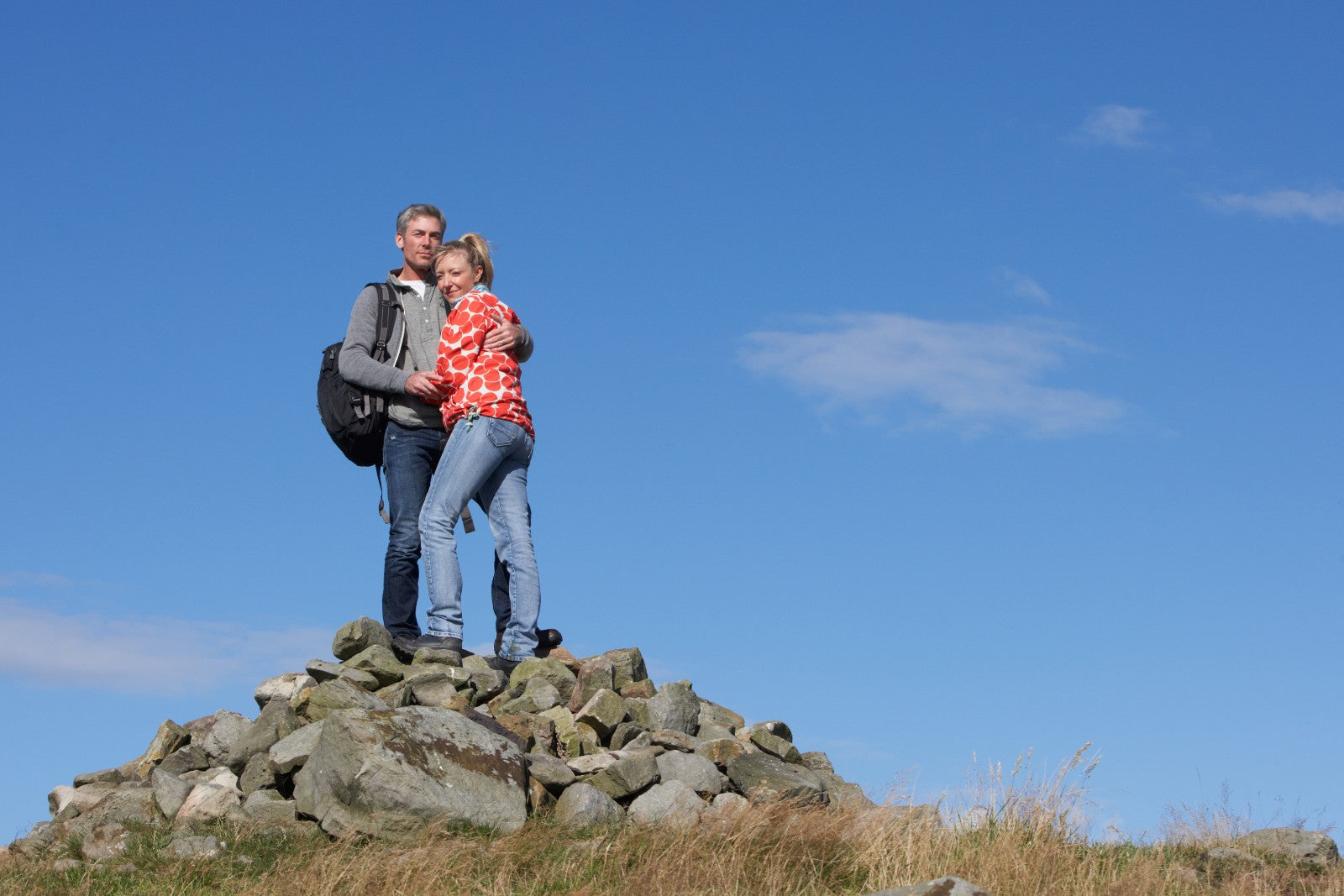Hikers on rocky summit after successful bypass surgery to help illustrate 10 Surprising Benefits of Bariatric Surgery You Need to Know