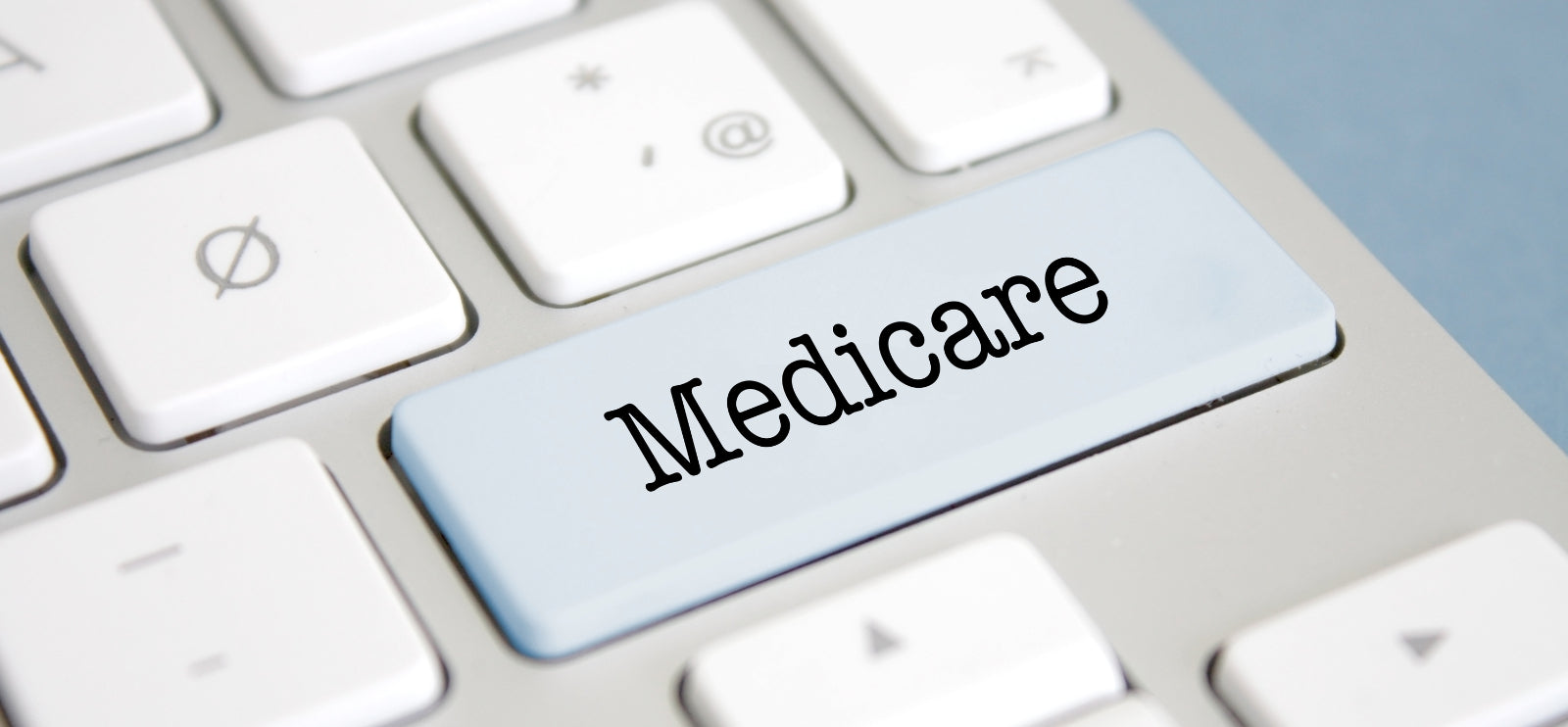 Graphic with Medicare on one of the keys of a keyboard.