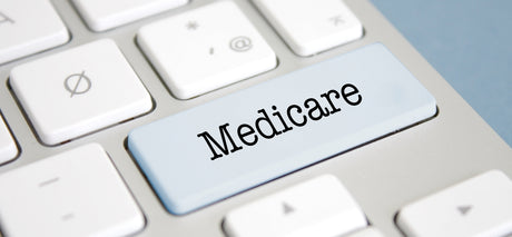 Graphic with Medicare on one of the keys of a keyboard.