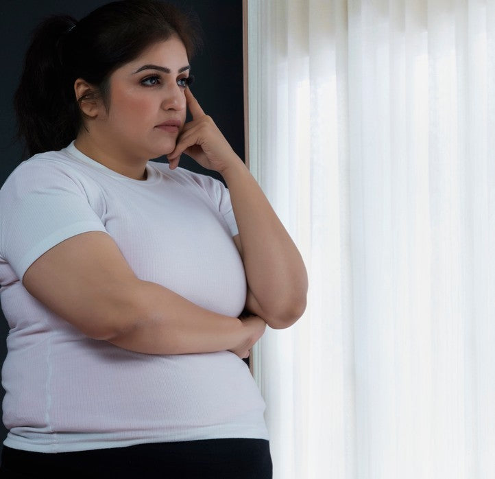 Obese woman at window