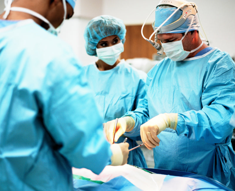 An image of Surgeons performing a Gastric Sleeve Procedure to help illustrate Bariatric Surgery vs. Non-Surgical Weight Loss Methods and best weight loss surgery and bariatric surgical procedures
