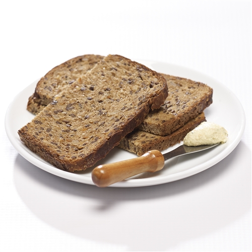brown bread with butter on a knife to illustrate diet burnout