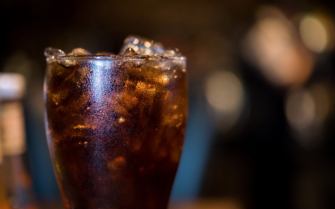 glass of cola with ice to illustrate How Long After Bariatric Surgery Can You Have Caffeine