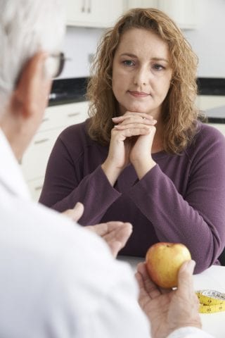 woman meets with doctor to talk about emotional eating 