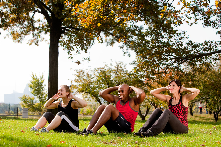 A group of people doing exercises in the park