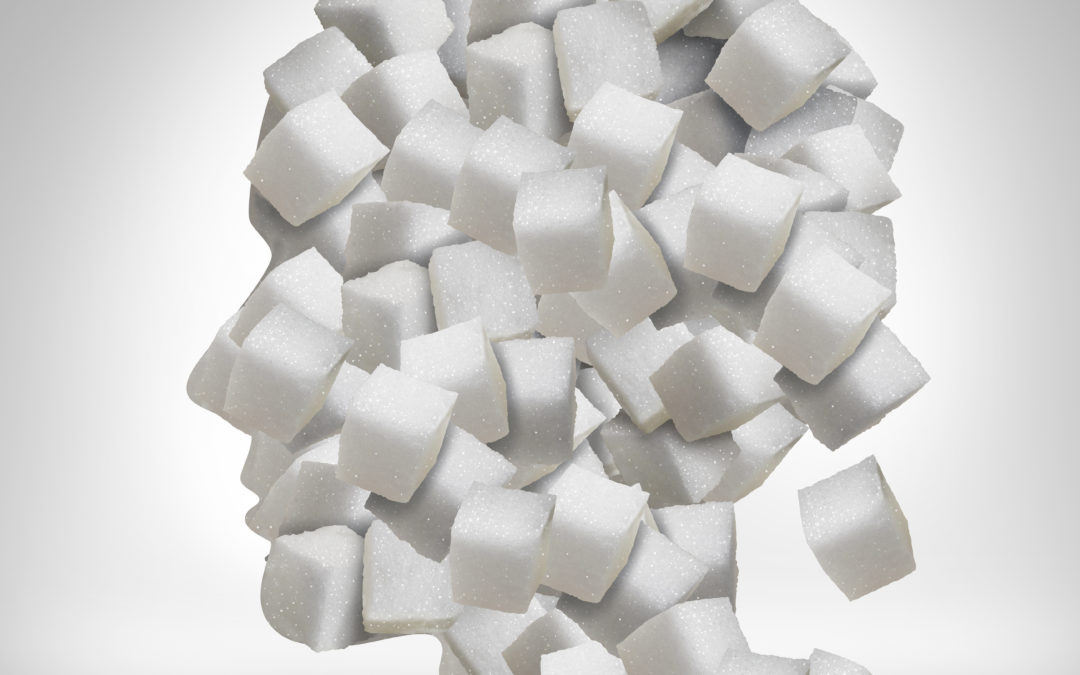 Sugar addiction concept as a human head made of white granulated refined sweet cubes as a health care symbol for being addicted to sweeteners and the medical issues pertaining to processed food to illustrate Pre-Diabetes And Major Cardiovascular Event