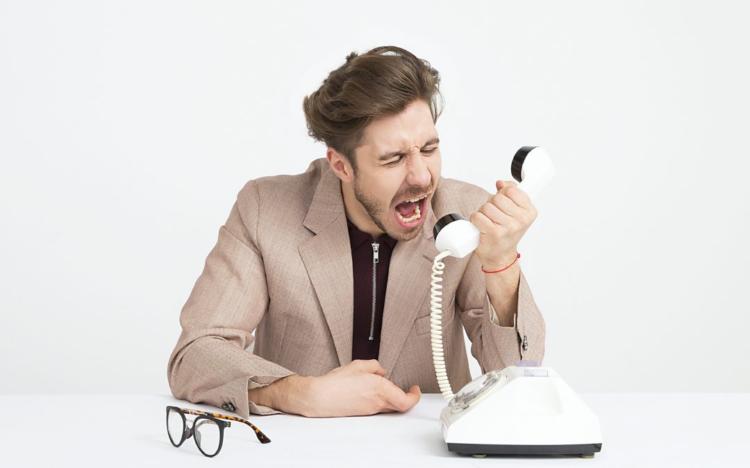 Man yelling into a phone to show anger after gastric sleeve.