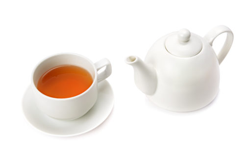 Cup of tea with white teapot on a white background to help illustrate all liquid diet.