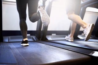 Legs are seen running on a treadmill.